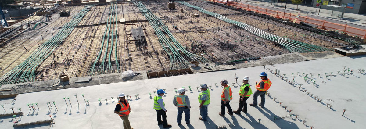 Construction workers surveying a site