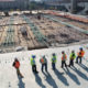 Construction workers surveying a site