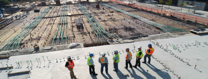 Construction workers surveying a site